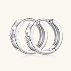 Side profile view of gold huggie hoop earrings showing thickness and curve