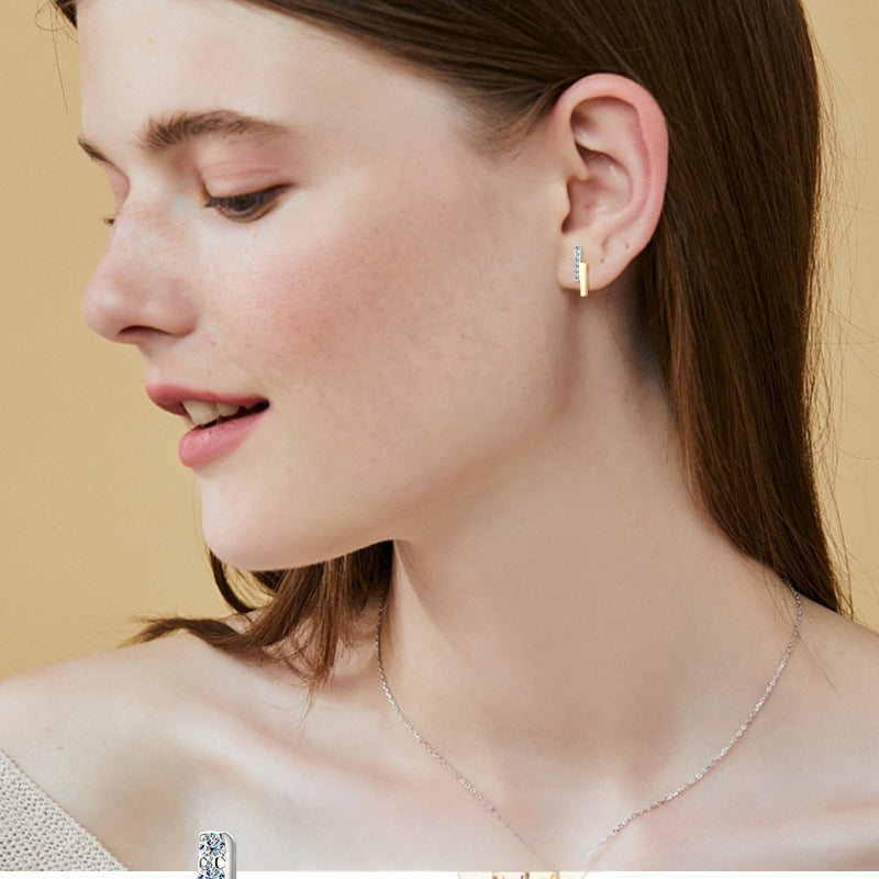 Close-up detail of moissanite stones set in Luckinging hoop earrings