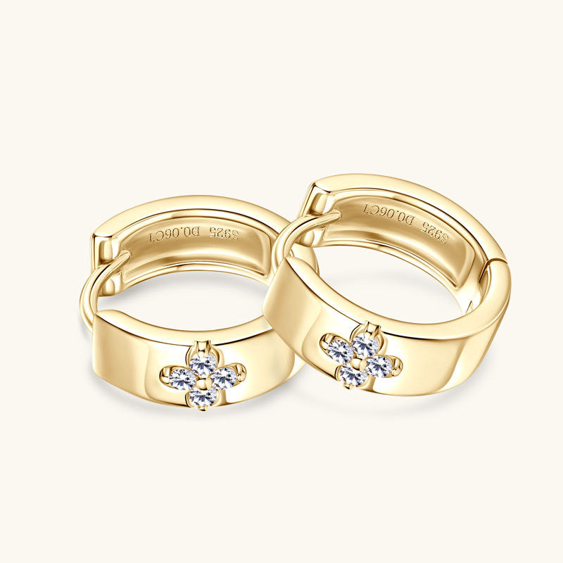 Front view of Luckinging huggie earrings on ear