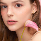 Elegant huggie hoop with subtle shine and stone detail