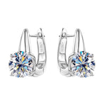 Lifestyle shot of moissanite huggie earrings on model in natural lighting