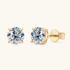 Gold huggie earrings with moissanite stone close up