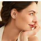 Side view of luckinging huggie stud earrings