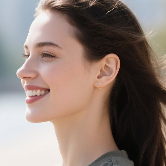 Side view minimalist gold stud earrings comfortable design