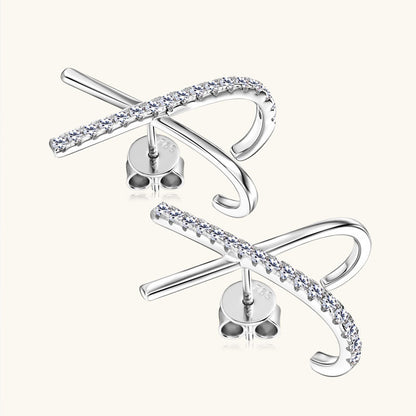 Model wearing elegant cross moissanite stud earrings daily fashion styling