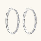 Close-up of 925 sterling silver earring with moissanite stone