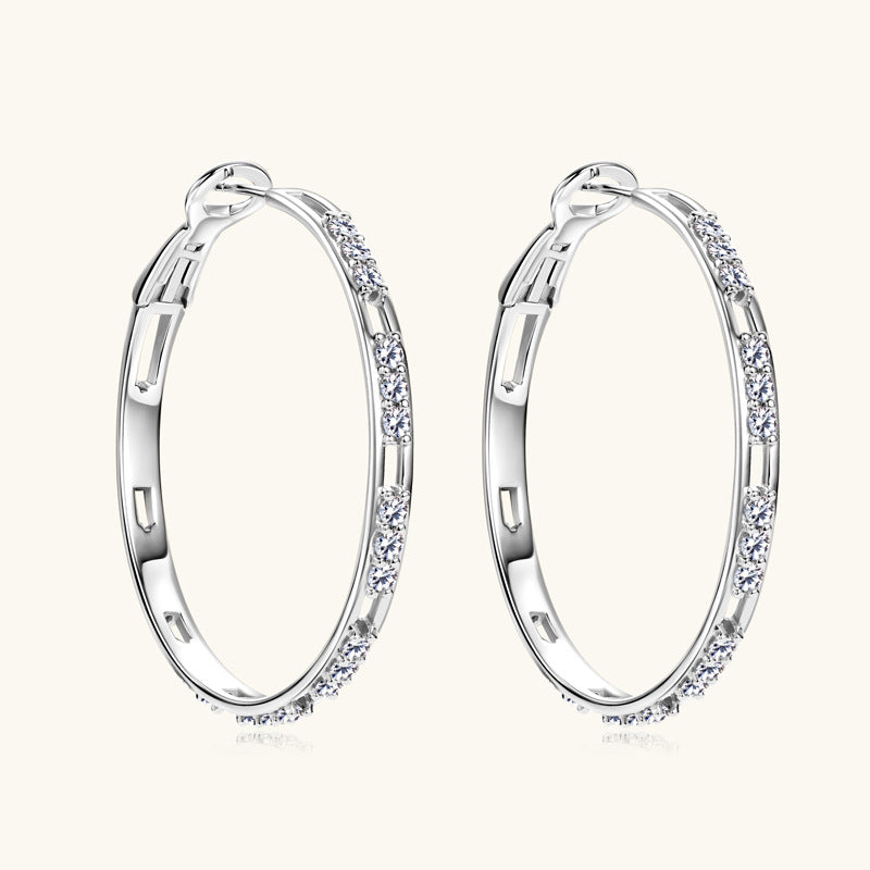 Close-up of 925 sterling silver earring with moissanite stone