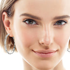 Elegant moissanite drop earrings on model ear