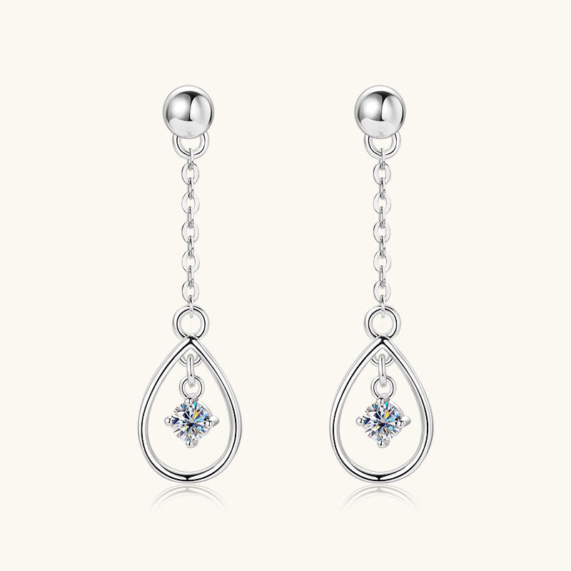 Side angle shot of Luckinging moissanite drop earrings highlighting design and shine