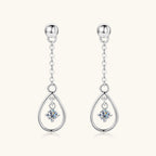 Side angle shot of Luckinging moissanite drop earrings highlighting design and shine