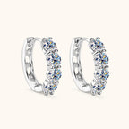 Side view of Luckinging Moissanite Huggie Earrings on model ear