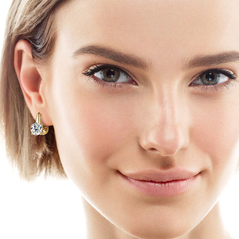 Woman wearing small sterling silver huggie earrings lifestyle photo