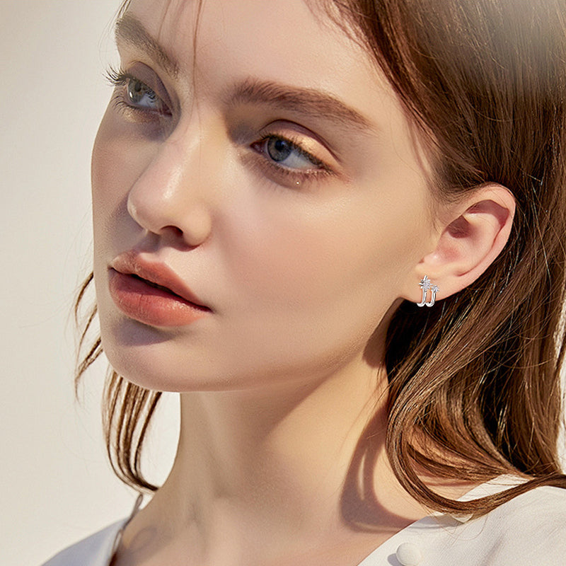 Sparkling moissanite in star shaped huggie stud earrings