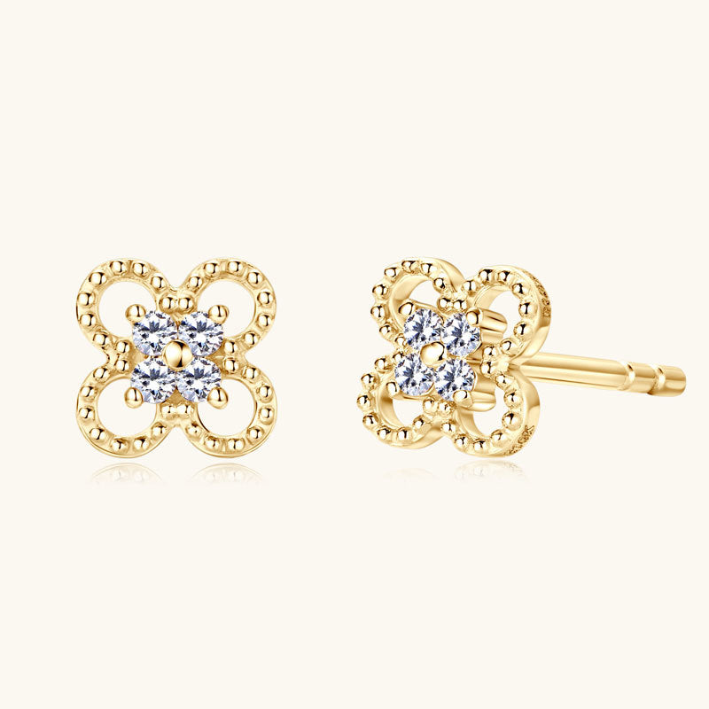 10K Gold star stud earrings with moissanite stones close up