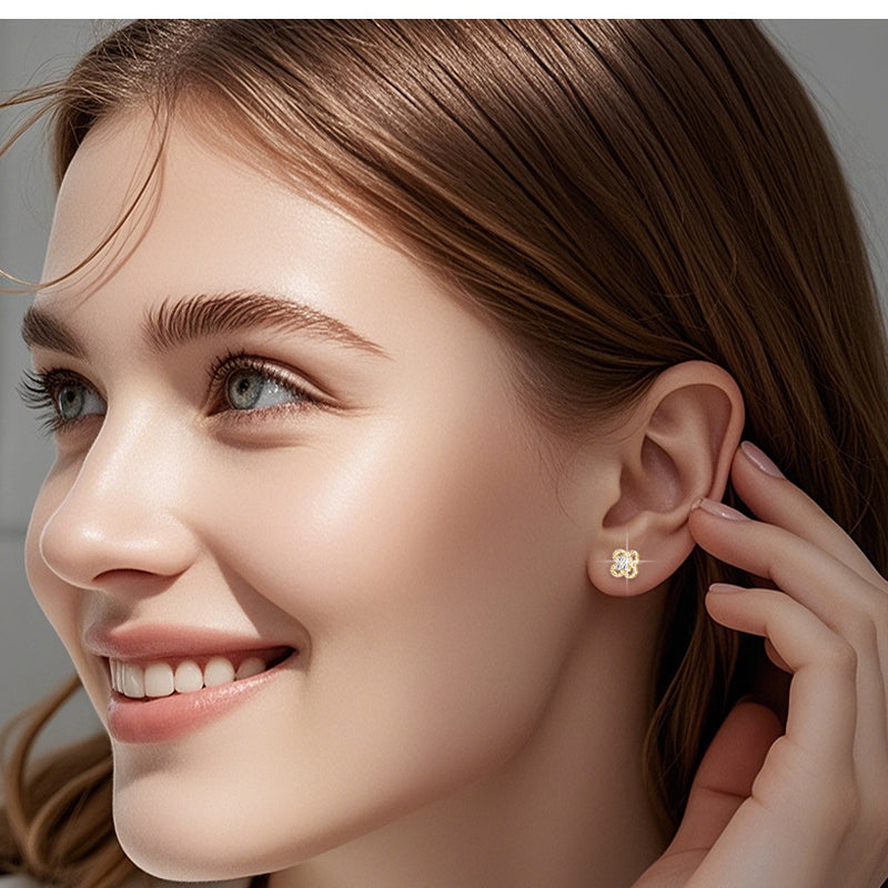 Front angle of star design gold earrings with sparkle