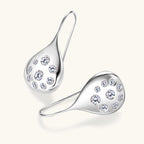 Luxury product display of Luckinging teardrop earrings on a styled background