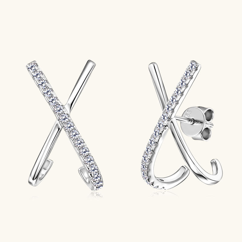 Close-up of Luckinging X-shaped moissanite stud earrings showing silver and stone detail