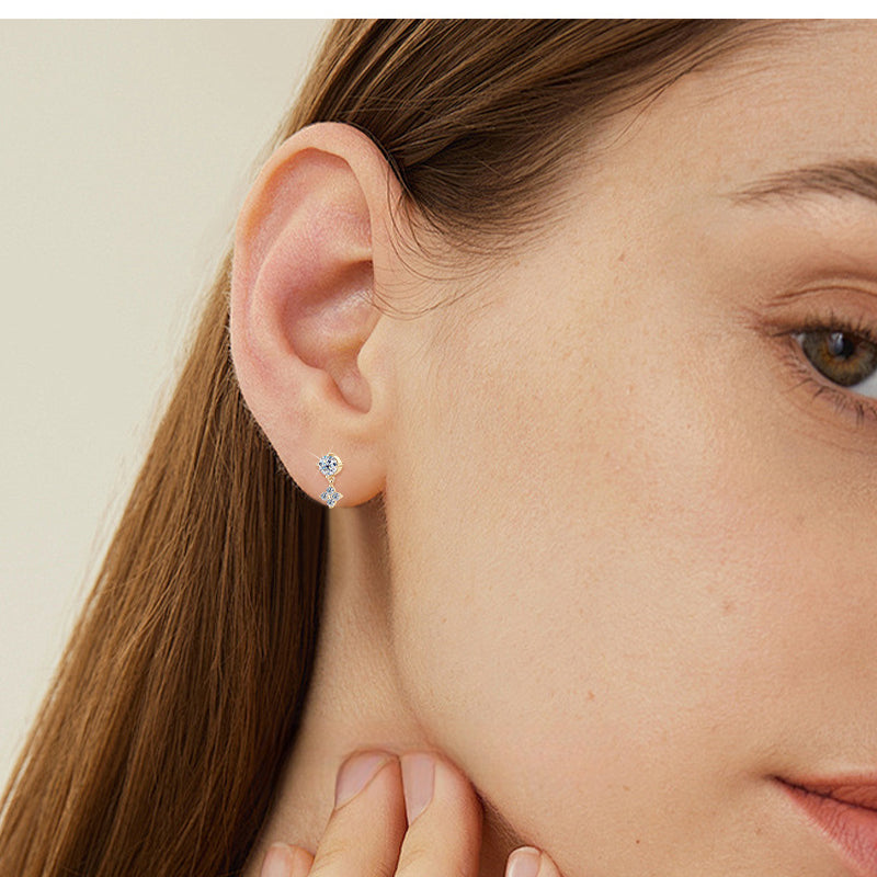 Side perspective of flower dangle earring showcasing design