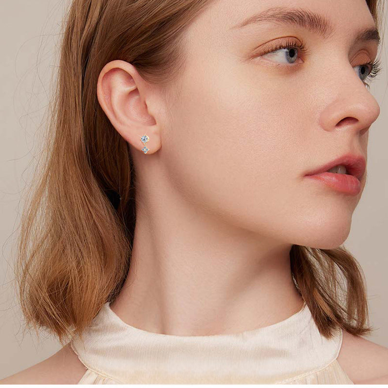 Profile angle showing dangle movement of luckyking floral earring
