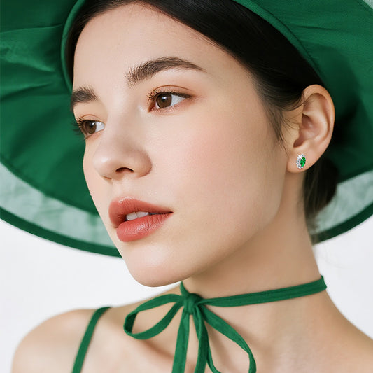 Detailed view of luxury emerald star stud earrings