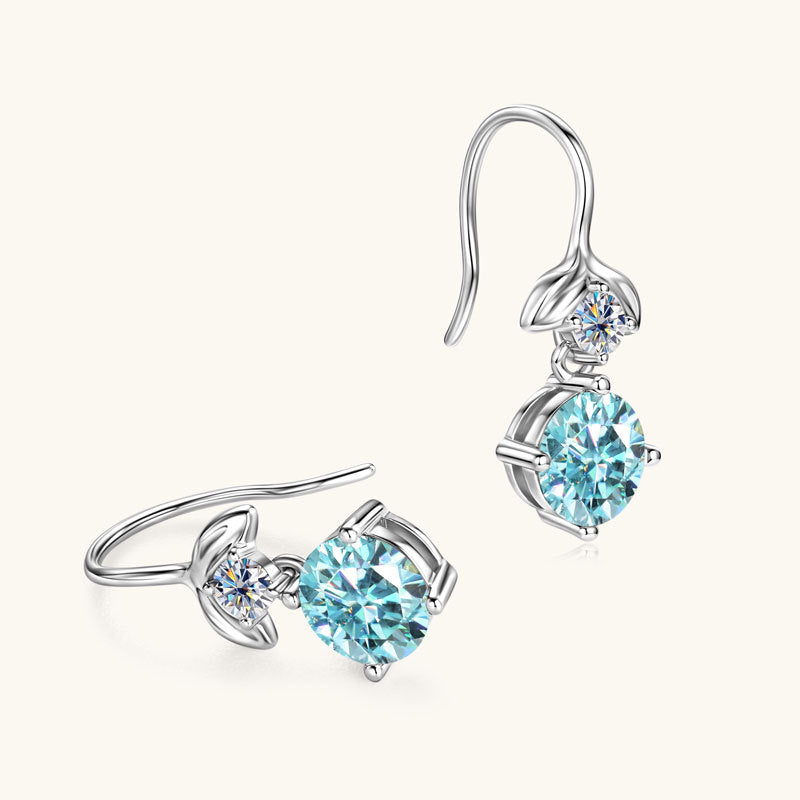 Close-up detail of the 6.5mm Mermaid Blue Moissanite stone in the earring