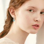 Full image of the paired Mermaid Blue Moissanite Teardrop Earrings
