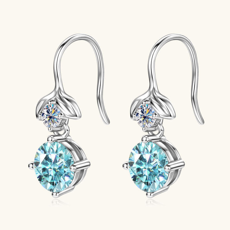 Side angle shot of the teardrop Moissanite earrings highlighting their dangle form