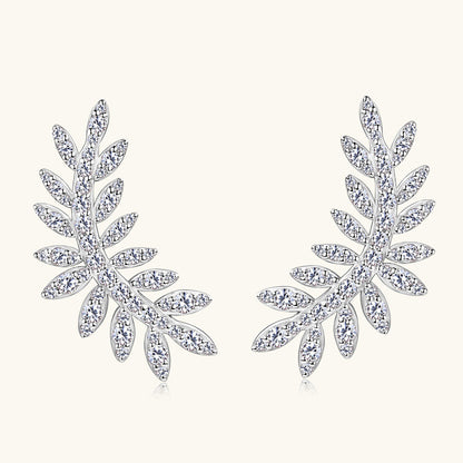 Minimalist botanical stud earrings pair on white background