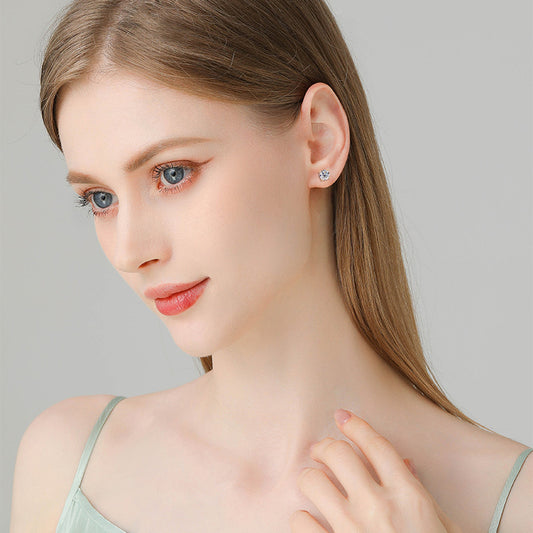 Woman wearing gold huggie hoop earrings side profile showcasing perfect fit and style