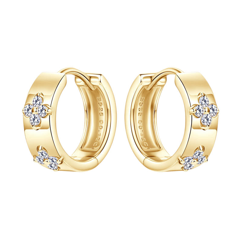 Minimalist gold huggie hoops styled for elegant everyday wear showing versatile jewelry design