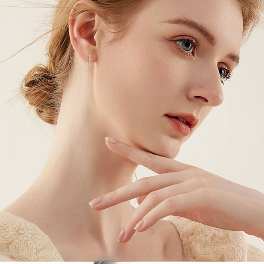 Close-up detail of premium 14K gold stud earrings highlighting polished finish quality