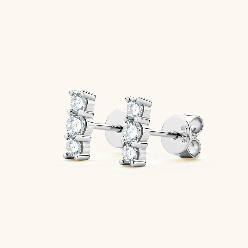 Close up detail of moissanite stone in sterling silver setting showing exceptional fire and clarity