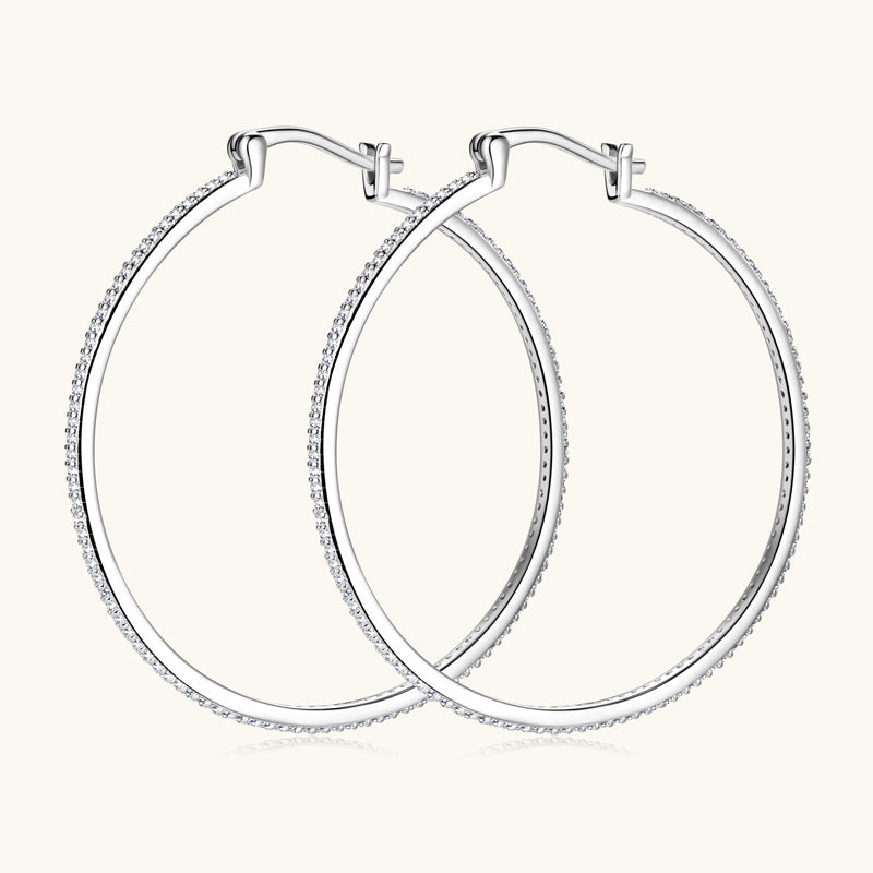 Side angle view of the silver moissanite stud earrings