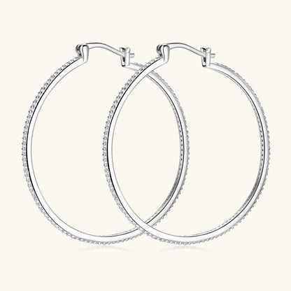 Side angle view of the silver moissanite stud earrings