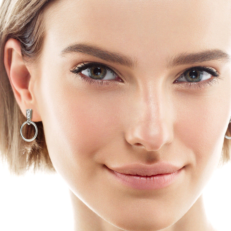 Overall view of the pair of dangle earrings on model or mannequin