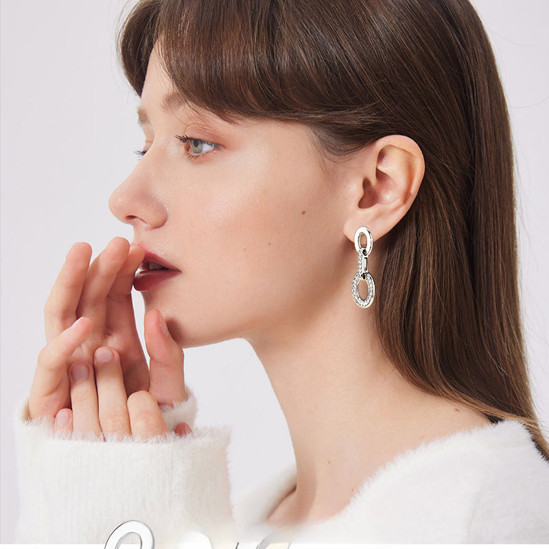 Side view of silver hoop earrings showcasing the lightweight design