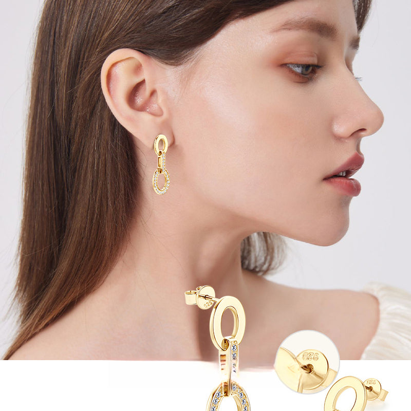 Front view of silver hoop earrings with delicate moissanite accents
