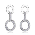 Minimalist silver hoop earrings in natural light
