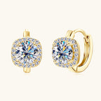 Small silver hoop earrings with a moissanite stone