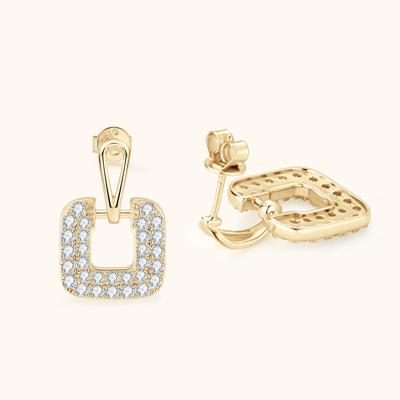 Silver earring with square design on model ear