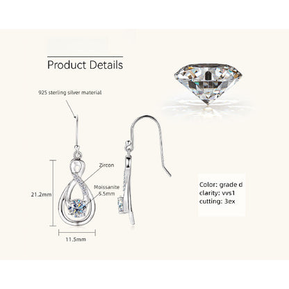 Professional woman wearing silver teardrop earrings at work