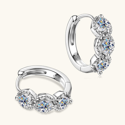 Small gold huggie earrings side angle view displaying secure clasp mechanism