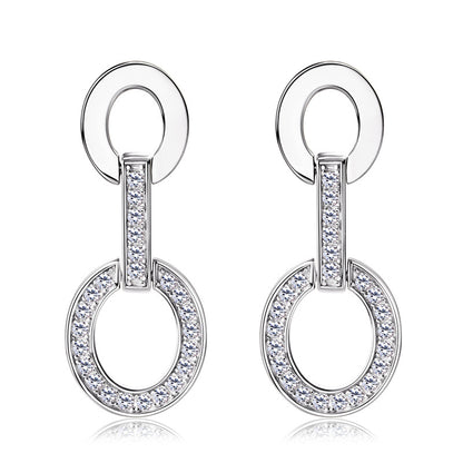 Professional styling with small silver hoop earrings
