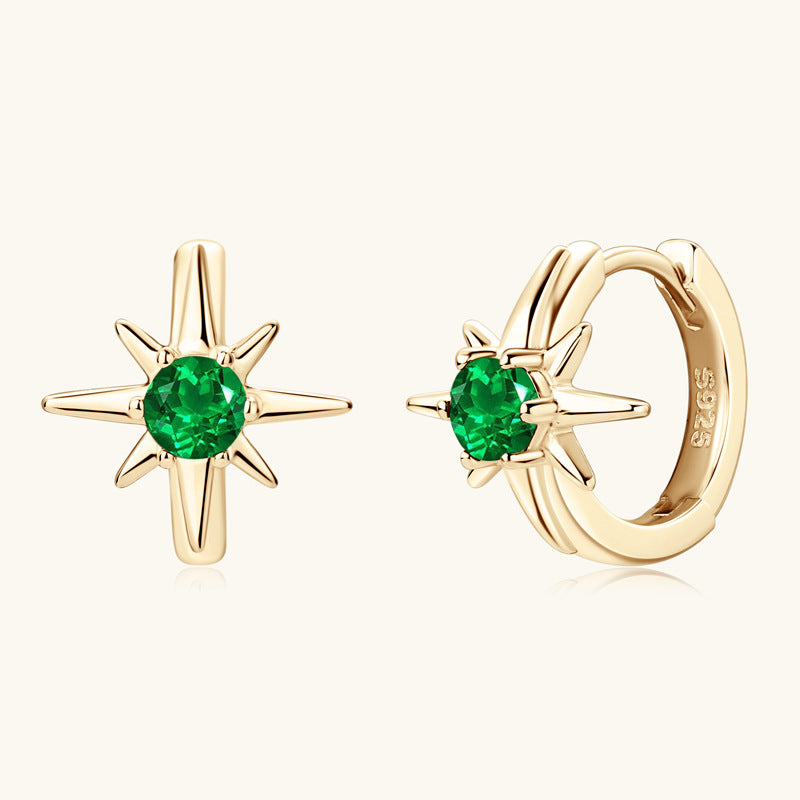 Front view of Luckinging star-shaped emerald huggie earrings showing green stone and star prongs