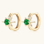 Display of the paired huggie earrings showing symmetry and design
