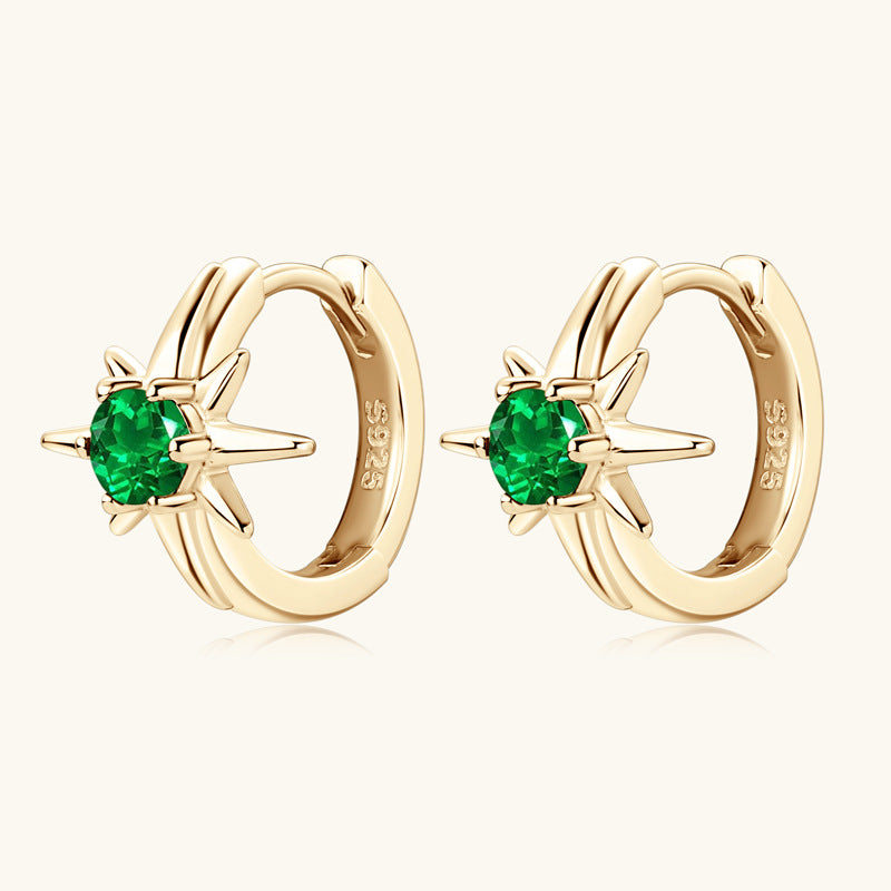 Display of the paired huggie earrings showing symmetry and design