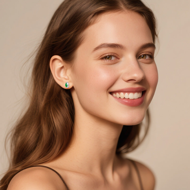 Dainty star earring with synthetic emerald
