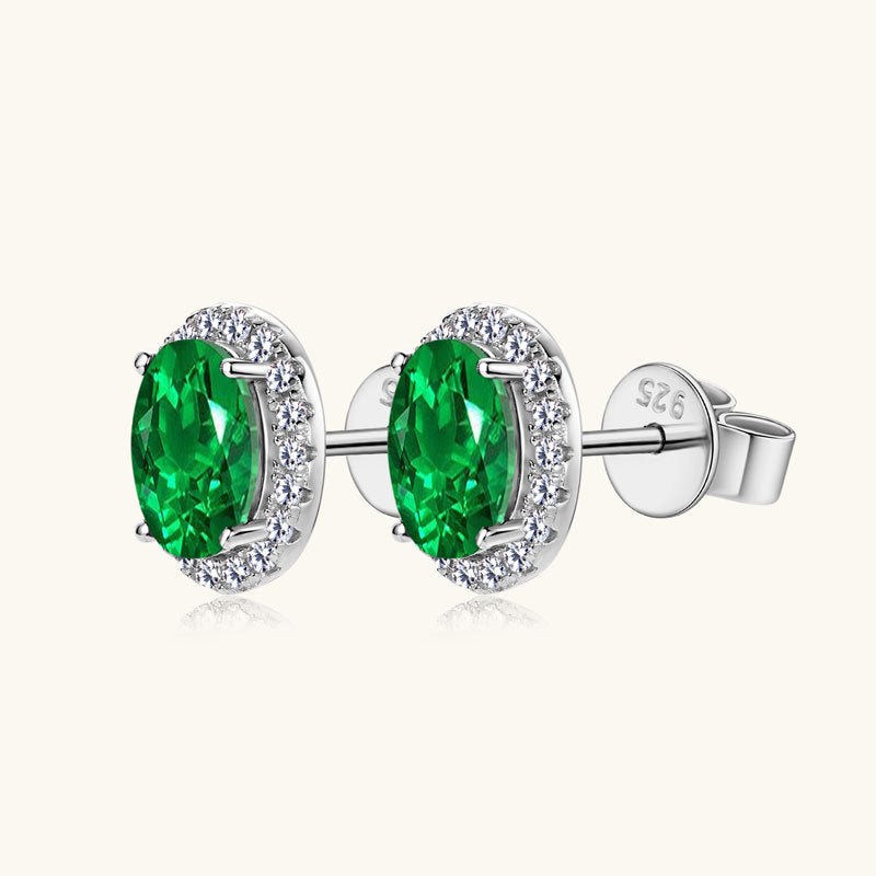 Close-up of star-shaped hoop earrings with central gem