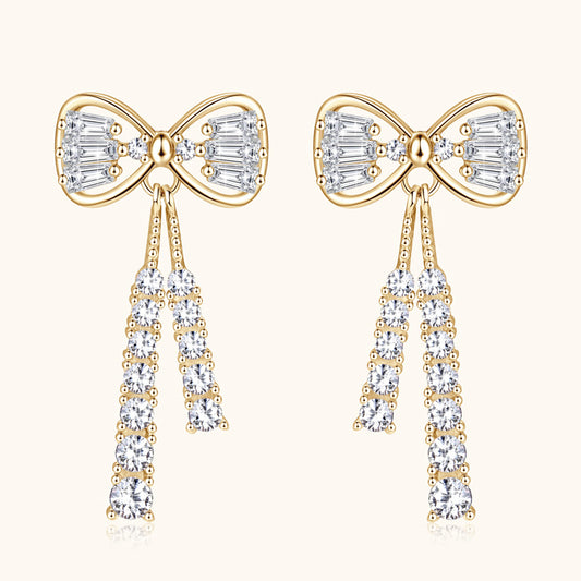 Sterling silver bow stud earrings with polished finish and flat back design
