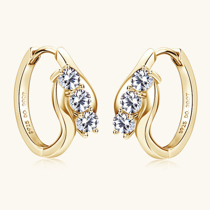 Sterling silver huggie hoop earrings with moissanite stones front view showing brilliant sparkle